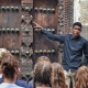 Tour guide explaining Stone Town history Zanzibar