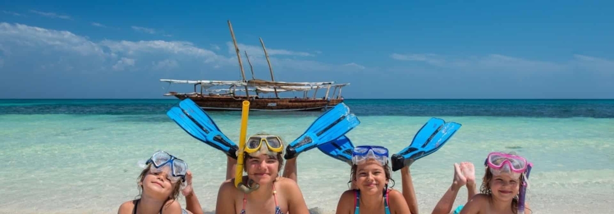 Zanzibar beach tours for families enjoying white sand beach