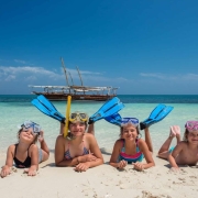 Zanzibar beach tours for families enjoying white sand beach